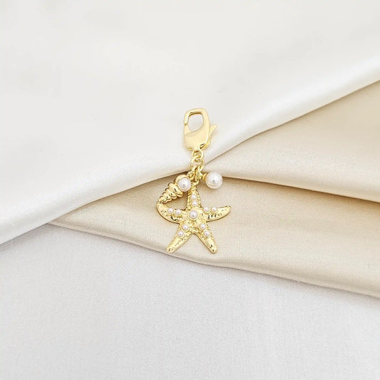 Llavero Estrella De Mar Y Caracol Con Perlas Dorado Rf K6938