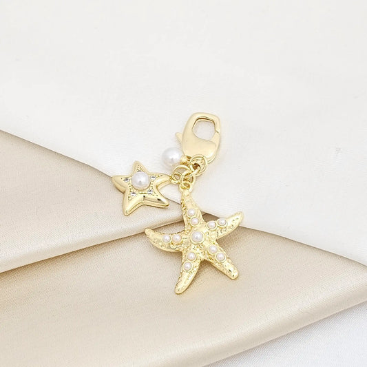 Llavero Perla Y Doble Estrella De Mar Circones Dorado Rf K7371