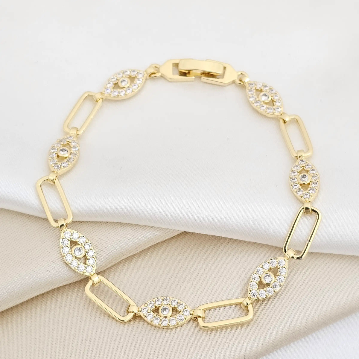 Pulsera Aros Y Ojos Con Circones Broche Dorado Rf K6989