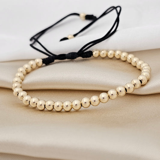 PULSERA GOLD  #4 NEGRA